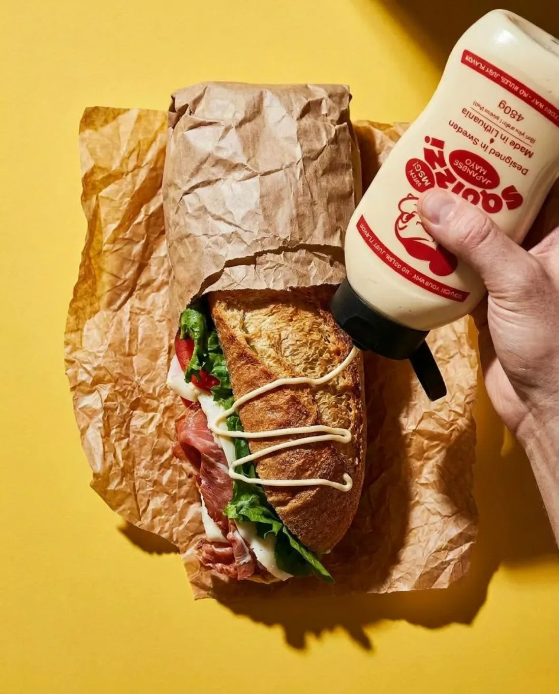 A sandwich wrapped in Squizzi branded paper